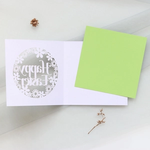 Laser-cut Happy Easter card featuring delicate daisy patterns and light green liner