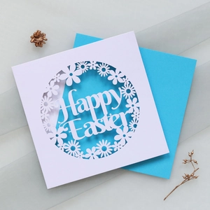 Detailed laser-cut Happy Easter card with white floral hollow pattern and blue inner sheet