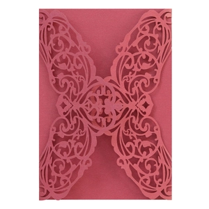 Elegant laser-cut wine red invitation cover with delicate floral and butterfly patterns