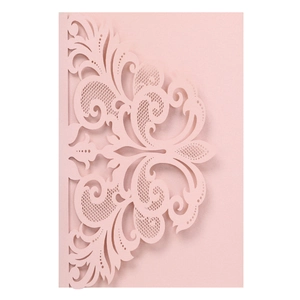 Detail of pink laser-cut lace wedding invitation with damascus scroll patterns