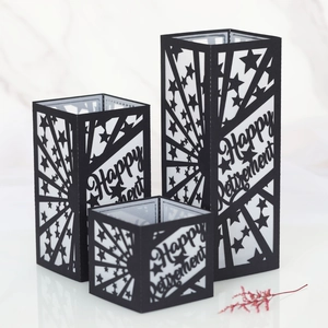 Three-piece black cutout paper candle shades with Happy Retirement lettering and stars