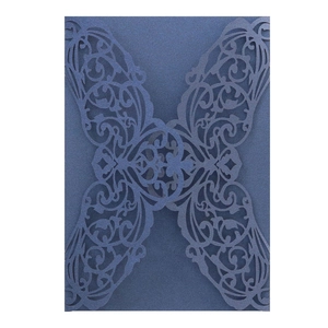 Detailed laser-cut navy blue wedding invitation cover with elegant floral hollow pattern