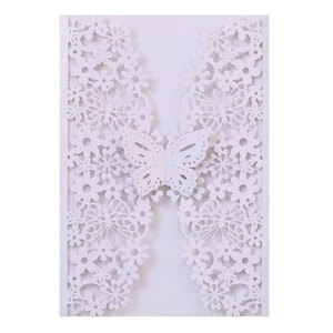 White laser-cut invitation cover with butterfly and floral patterns for weddings