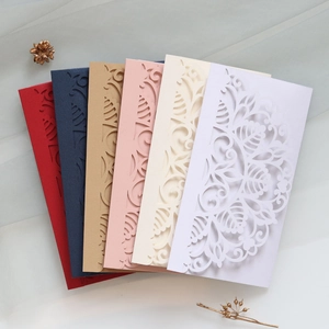 Laser-cut wedding invitations in six elegant colors with detailed floral scrollwork