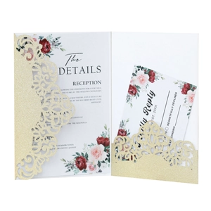 Detailed laser cut glitter wedding invitation pocket with floral details and reply card