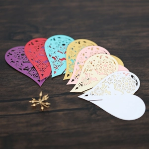 Laser-cut heart-shaped wine glass cards in various colors with floral mandala patterns