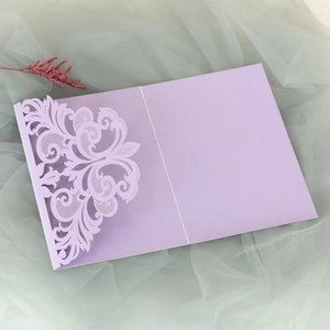 Detailed laser cut floral design on lavender lace wedding invitation sleeve