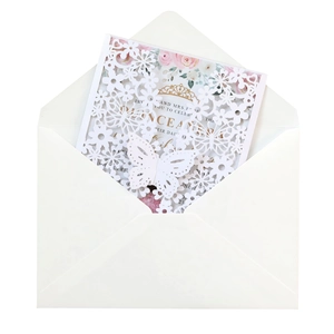 Detail view of laser-cut butterfly wedding invitation with envelope and floral inner card