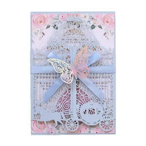 Laser cut wedding invitation with horse carriage design and blue silk ribbon bow