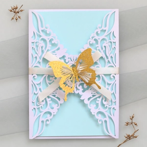 Laser cut blue invitation with white lace sleeve and 3D golden butterfly decoration