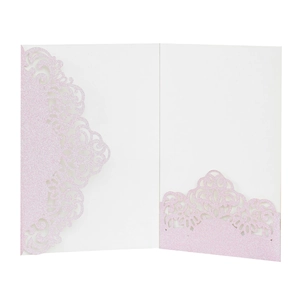 Detail of pink glitter laser-cut invitation card with elegant filigree pattern