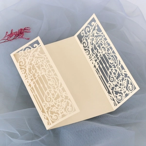 Elegant laser-cut gatefold wedding invitation cover with intricate vintage patterns