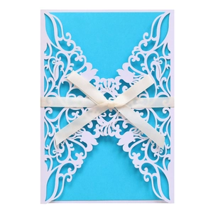 Laser cut butterfly wedding invitation with sky blue inner card and white ribbon bow