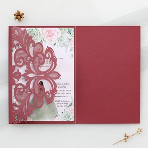 Elegant burgundy laser-cut lace wedding invitation with floral insert and gold accents