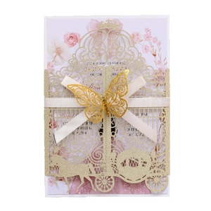 Golden laser cut wedding invitation with glitter finish and elegant butterfly ribbon