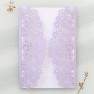 Detailed laser-cut lavender butterfly wedding invitation cover with intricate floral patterns