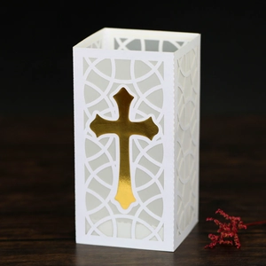 Detailed laser-cut white paper lantern with a golden mirror cross for religious decor
