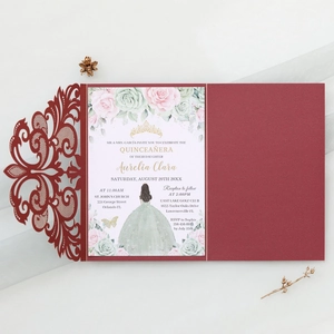 Detailed laser-cut lace pattern on burgundy wedding invitation card with floral insert