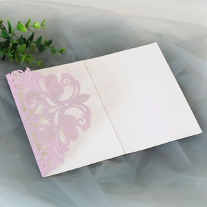 Laser cut pink glitter lace wedding invitation with a white inner card insert