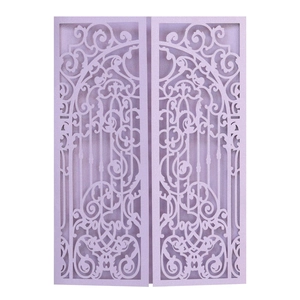 Detail of laser-cut lavender wedding invitation with intricate floral gate pattern