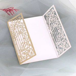 Detailed laser-cut glitter gold wedding invitation card with elegant floral hollow design