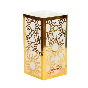 Close-up of golden paper lantern with laser-cut sun pattern and reflective metallic finish