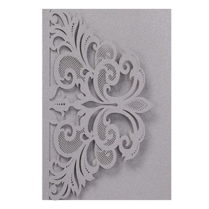 Detailed laser-cut silver glitter lace wedding invitation cover with baroque scroll pattern