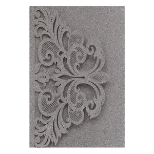 Silver glitter laser-cut lace wedding invitation with intricate hollow floral patterns
