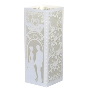 Laser-cut white paper lantern for Valentine's Day featuring a romantic couple silhouette