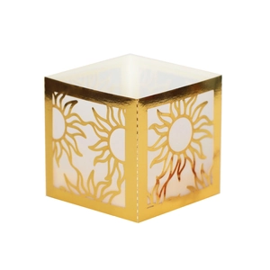 Detail of laser-cut hollow sun pattern on gold reflective electronic candle paper lampshade