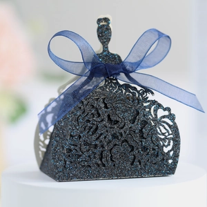 Close-up of laser-cut hollow pattern and black glitter finish on wedding favor box