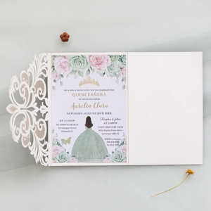 Macro view of laser-cut floral invitation shell with ivory lace and elegant rose details