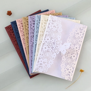 Detailed laser-cut invitations with butterfly patterns in eight elegant colors