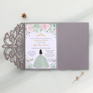 Detail view of purple laser-cut lace wedding invitation with floral printed inner card