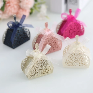 Detailed laser-cut rose hollow candy boxes with glitter finish and satin ribbons
