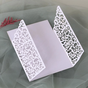 Detailed laser-cut lavender invitation card with intricate floral lace and three-fold design