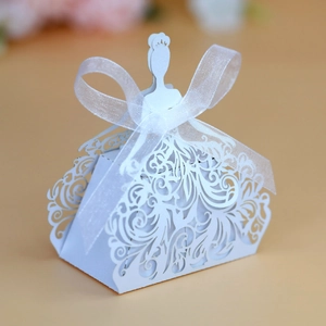 Detailed laser-cut white wedding dress candy box with elegant white organza ribbon bow