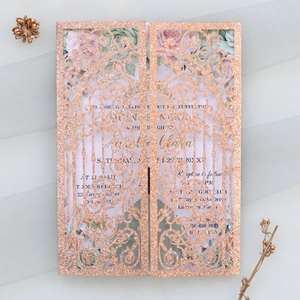 Detail of rose gold glitter laser-cut invitation with floral inner card and floral details