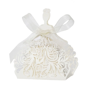 Close-up of laser-cut wedding favor box in bridal dress shape with white ribbon
