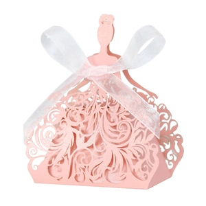 Detail of pink princess-shaped laser-cut gift box with a white organza ribbon bow
