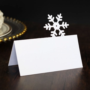 Detailed laser-cut snowflake place card for winter wedding or Christmas party table decor