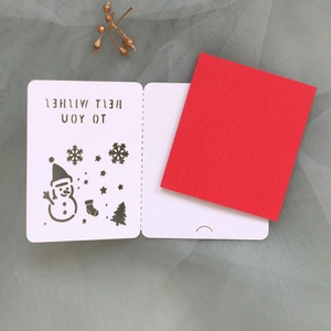 Detailed laser-cut Christmas card with snowman motifs and red paper insert decoration