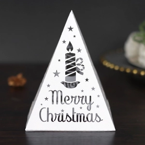 White pyramid Christmas lantern with cutout candle design and Merry Christmas text