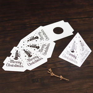 Flat lay of white Christmas pyramid gift box templates with Merry Christmas print