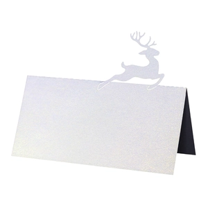 Close-up of 3D reindeer cutout on white glitter paper place card with laser-cut edges