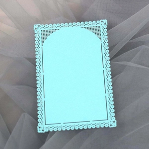 Detailed laser-cut light blue lace paper decoration card with floral patterns