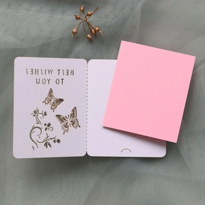 Detail of laser-cut butterfly greeting card with Best Wishes text and pink insert
