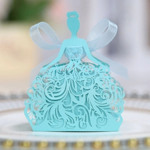 Close-up of light blue laser-cut candy box in dress shape with elegant ribbon bow