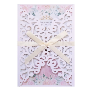 Elegant laser cut wedding invitation with white baroque pattern and silk beige ribbon bow