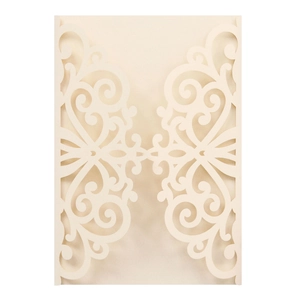Intricate laser-cut cream wedding invitation featuring symmetrical scrollwork details
